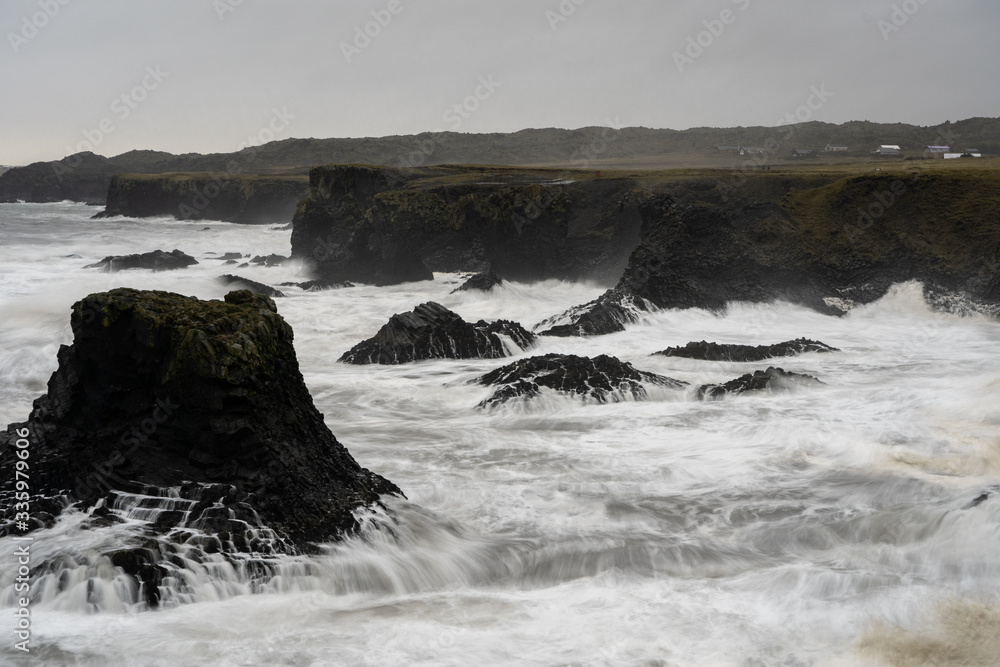 Long exposure of rock being hit by the waves in Iceland