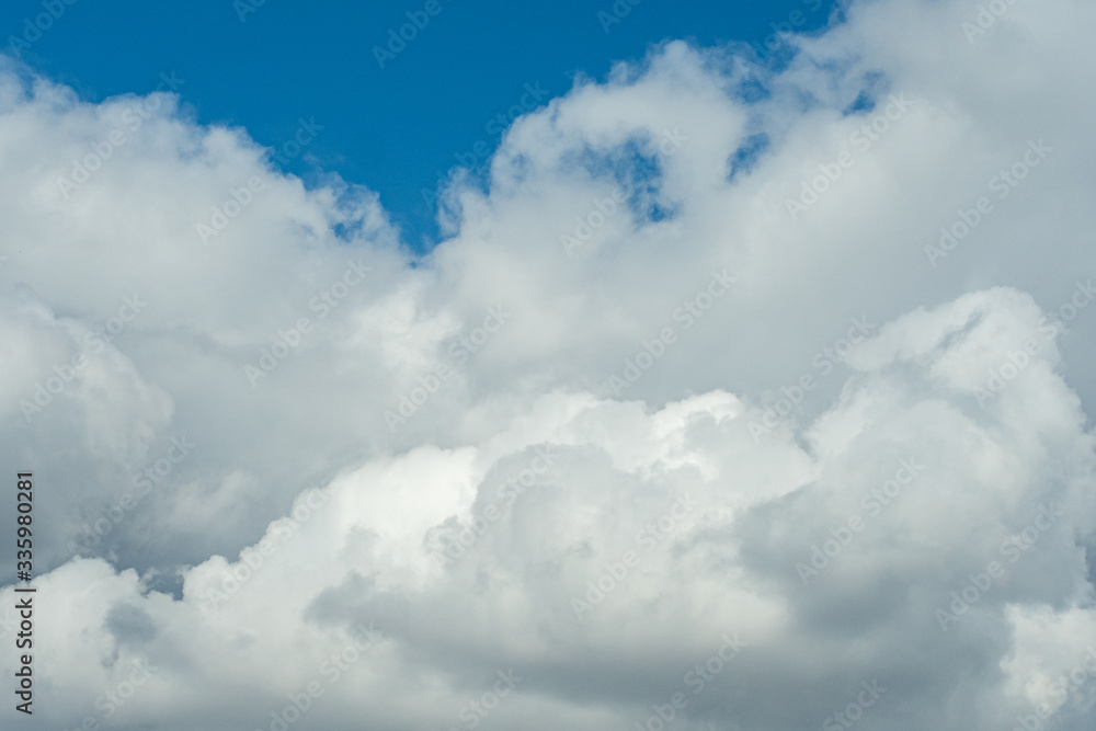 a huge cluster of fluffy cloudy under clear blue sky after rain a huge cluster of fluffy cloudy under clear blue sky after rain