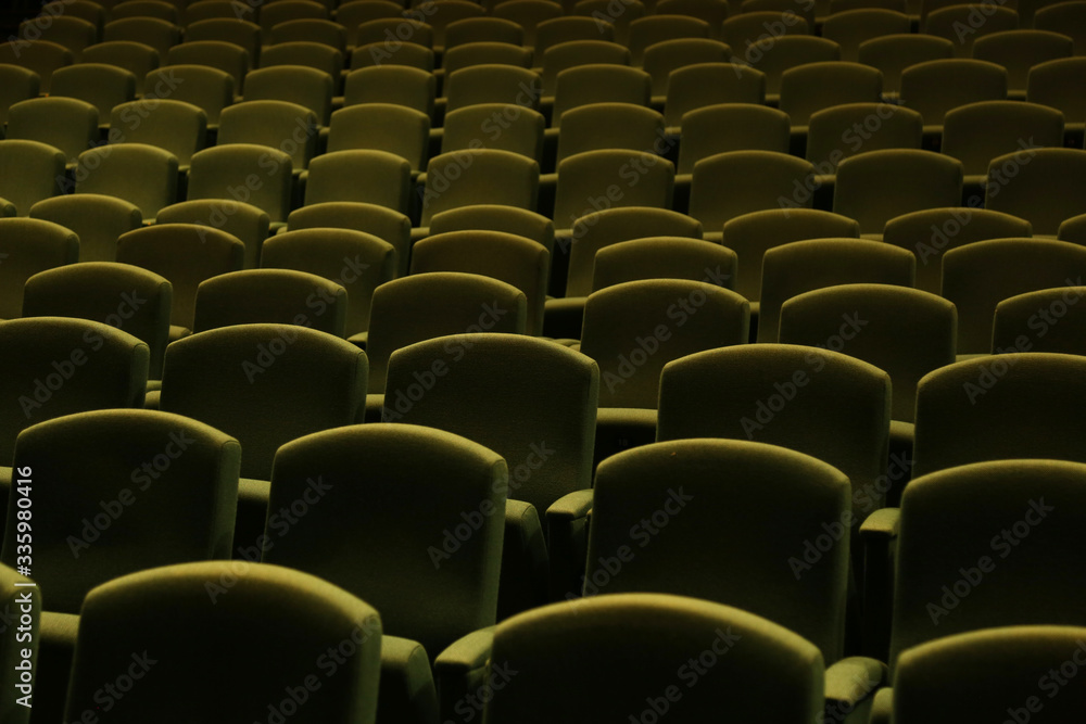 Fototapeta premium Green velvet seat in a theater