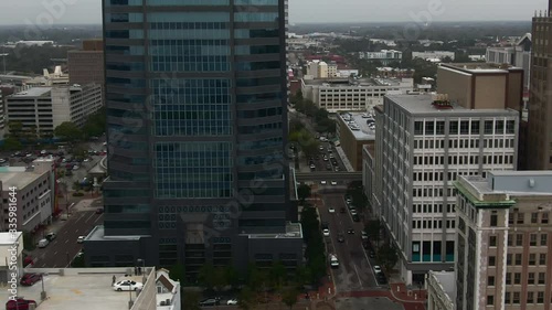 Cinematic aerial tilts from streets through to Jacksonville buildings photo