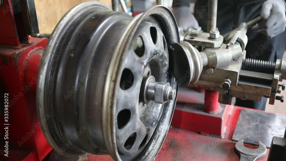 Process of tire repairing. Repair a tire from car by mechanic. Winter tires Process of tire repairing. Repair a tire from car by mechanic. Winter tires