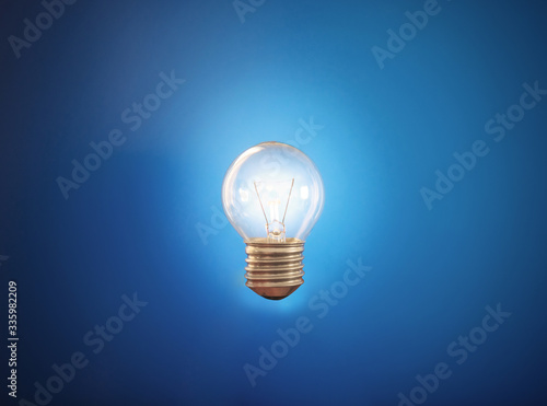 Glowing light bulb, on blue backgrounds
