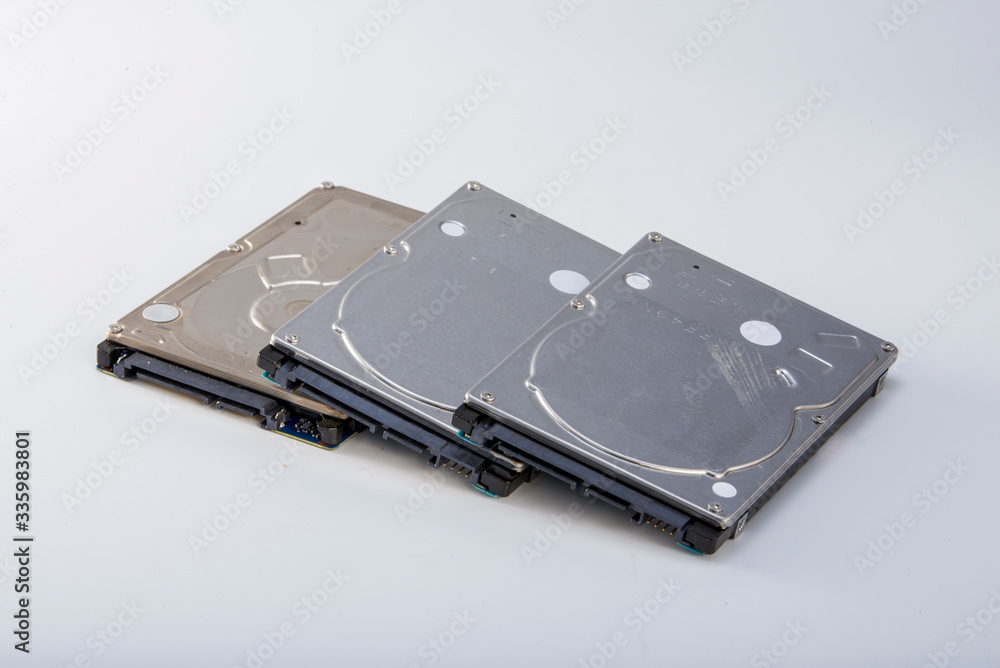 Three 2.5-inch mechanical hard drives close-up Three 2.5-inch mechanical hard drives close-up