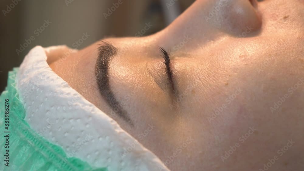 Professional change in the shape of female eyelashes in a beauty salon Professional change in the shape of female eyelashes in a beauty salon