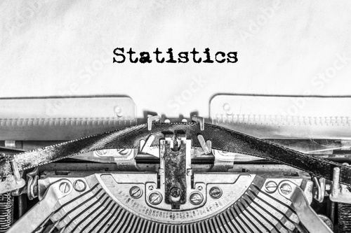 Statistics text typed on a vintage typewriter. Old paper, history