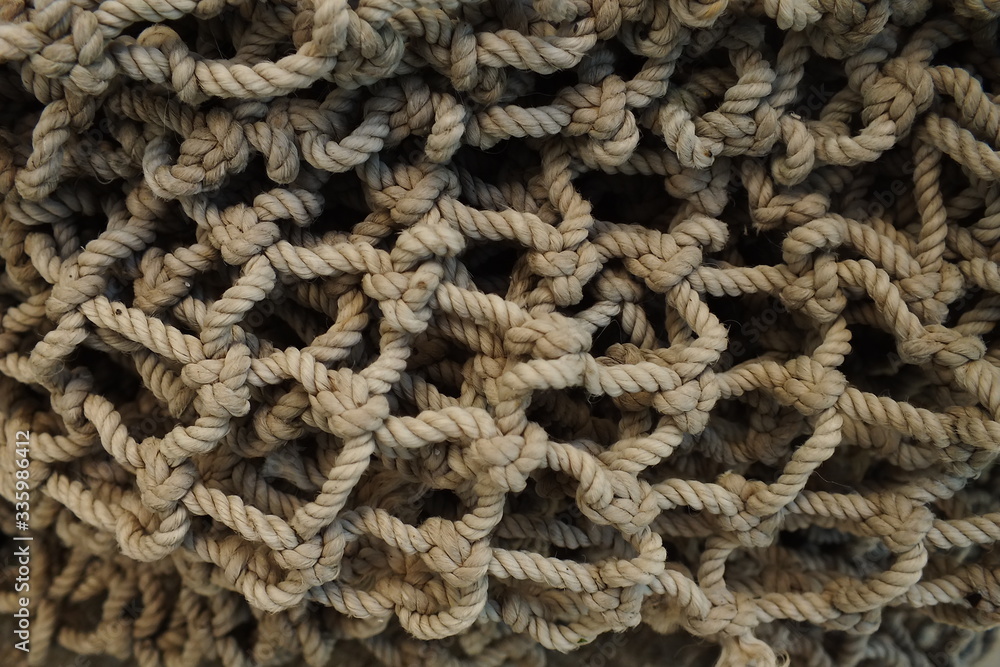 background macro image of a braided fishing net with large meshes background macro image of a braided fishing net with large meshes