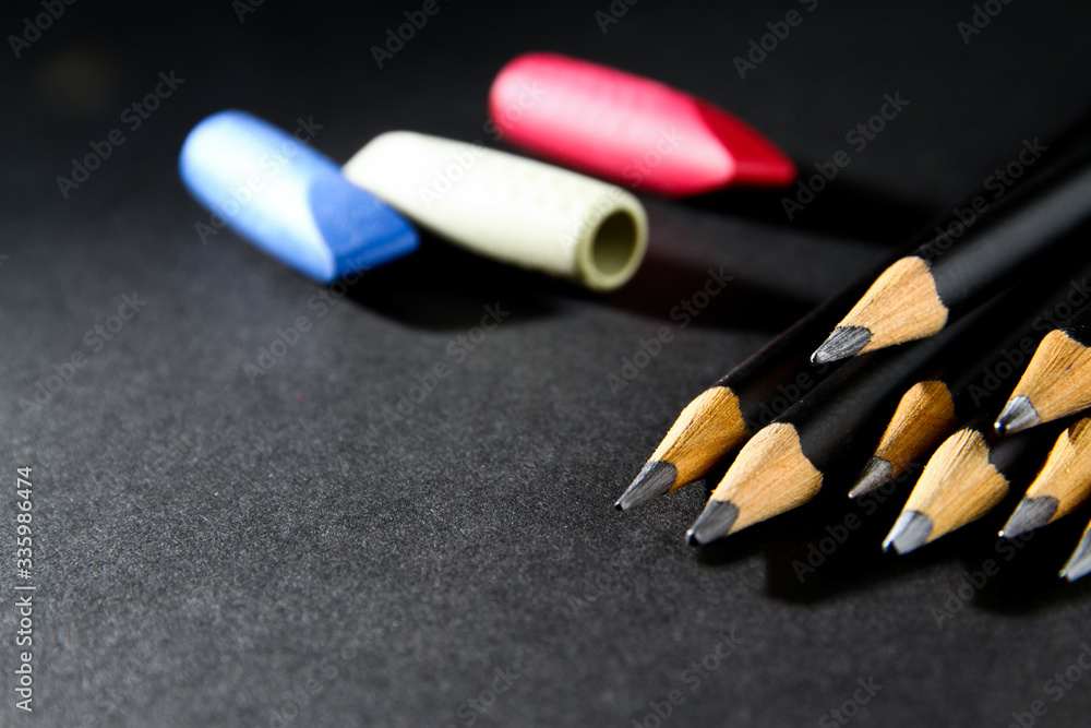 Wooden pencil on black background Wooden pencil on black background