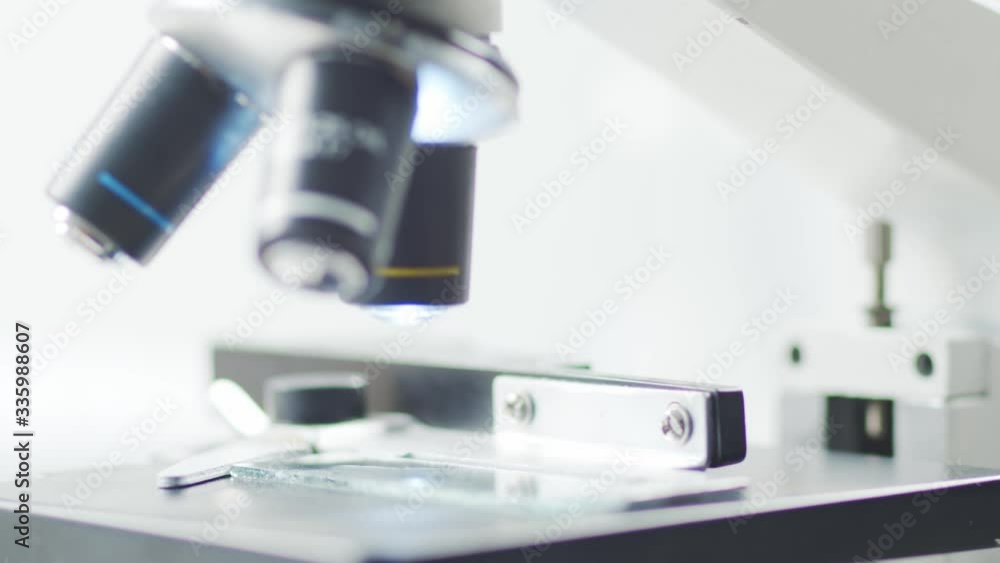 Close-up of scientific microscope. Laboratory in hospital. Epidemic disease, healthcare, vaccine research and coronavirus 2019-ncov test. Close-up of scientific microscope. Laboratory in hospital. Epidemic disease, healthcare, vaccine research and coronavirus 2019-ncov test.
