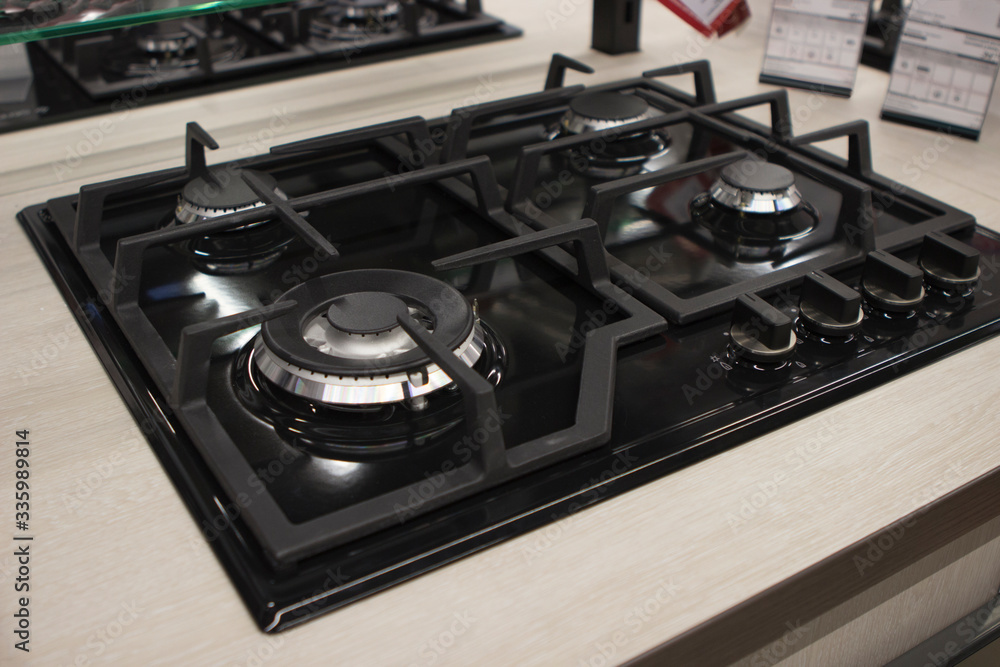 Recessed cooking gas black panel in the store on an advertising stand Recessed cooking gas black panel in the store on an advertising stand
