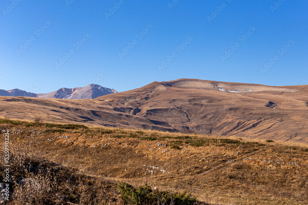 Autumn in the mountains, warm season, blue sky and nature says goodbye to summer. Autumn in the mountains, warm season, blue sky and nature says goodbye to summer.