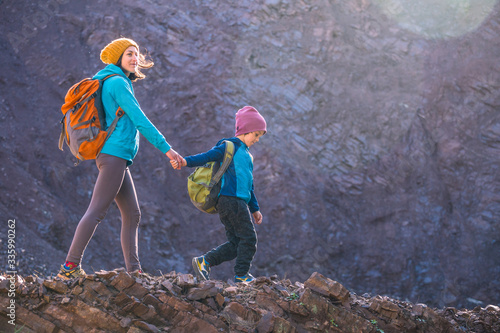 A woman is traveling with a child.