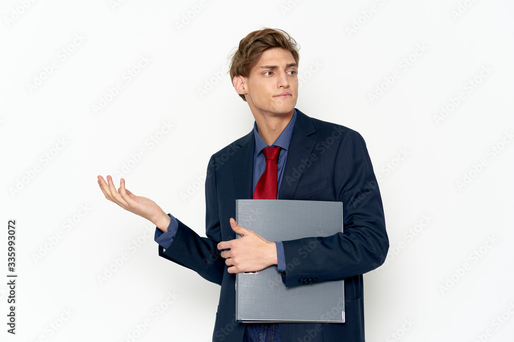 young businessman holding a clipboard young businessman holding a clipboard