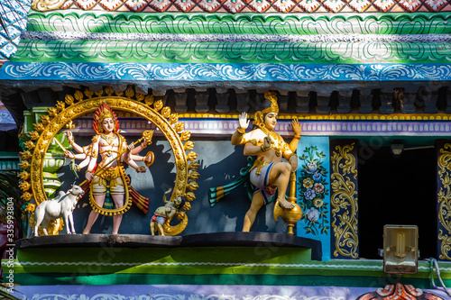 Hindu temple in Tamil Nadu, South India.  Sculptures on Hindu temple gopura (tower)
 photo