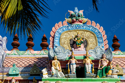 Hindu temple in Tamil Nadu, South India.  Sculptures on Hindu temple gopura (tower)
 photo