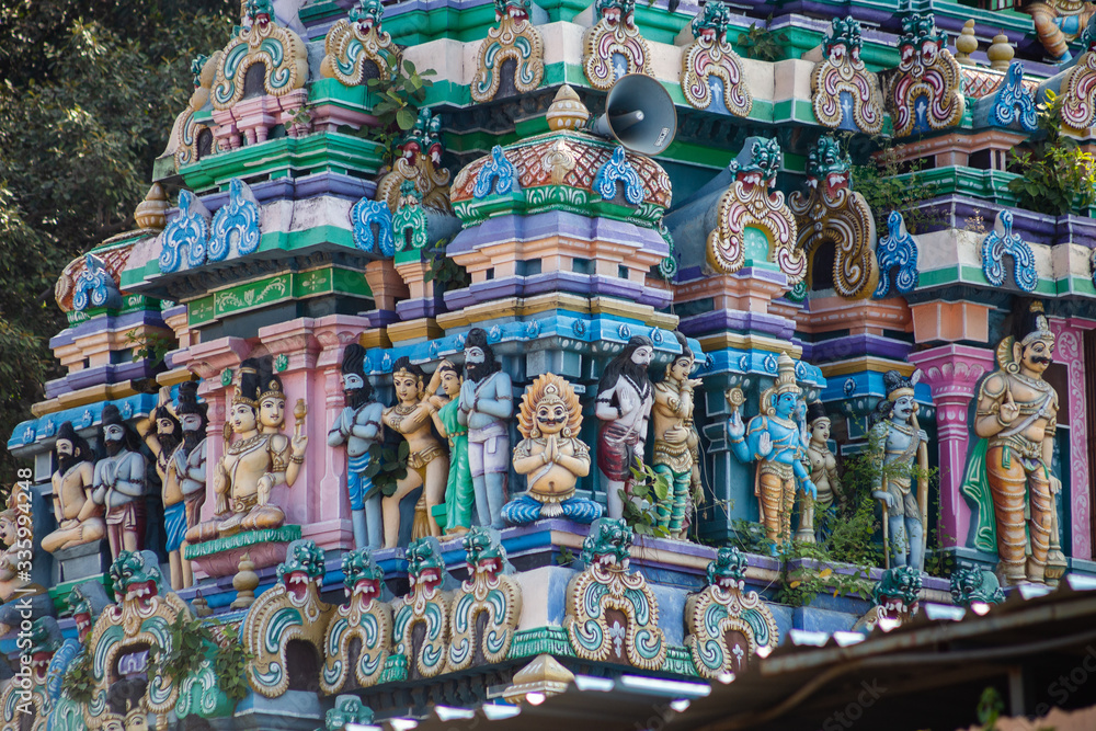Hindu temple in Tamil Nadu, South India.  Sculptures on Hindu temple gopura (tower)

