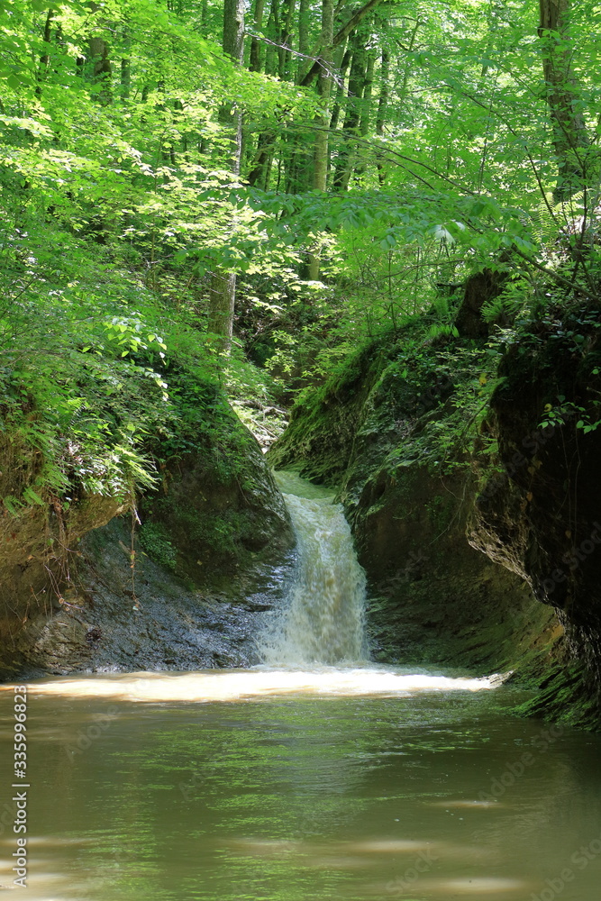 Waterfall on a mountain river in spring