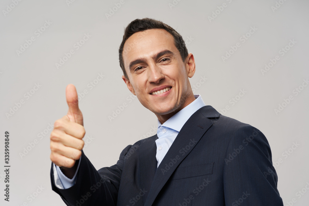 businessman showing thumb up businessman showing thumb up