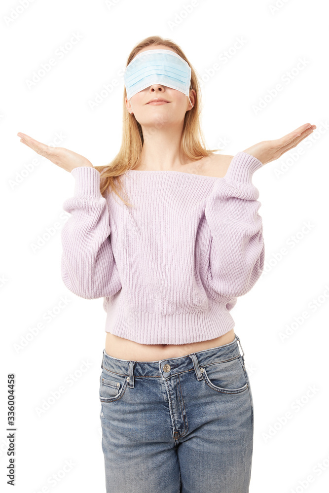 Blond woman with a face mask on her eyes Blond woman with a face mask on her eyes