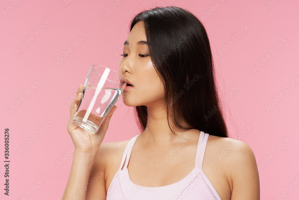 young woman drinking water young woman drinking water