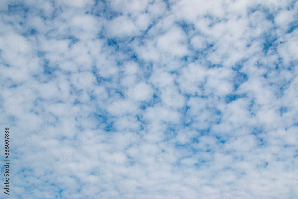 many small white clouds in the blue sky many small white clouds in the blue sky