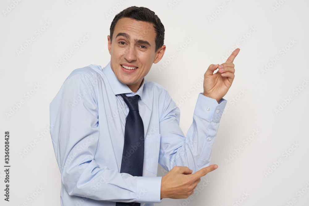 young businessman pointing at something young businessman pointing at something