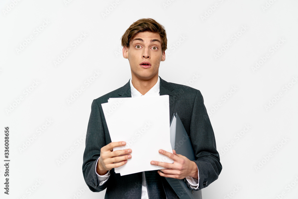 young businessman holding a blank card