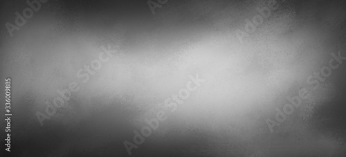 Black and white background, soft blurred texture and black border with silver gray center spotlight, abstract industrial or blank metal design