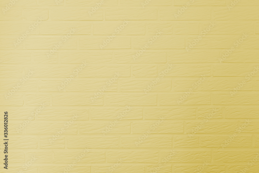 Yellow painted brick wall texture