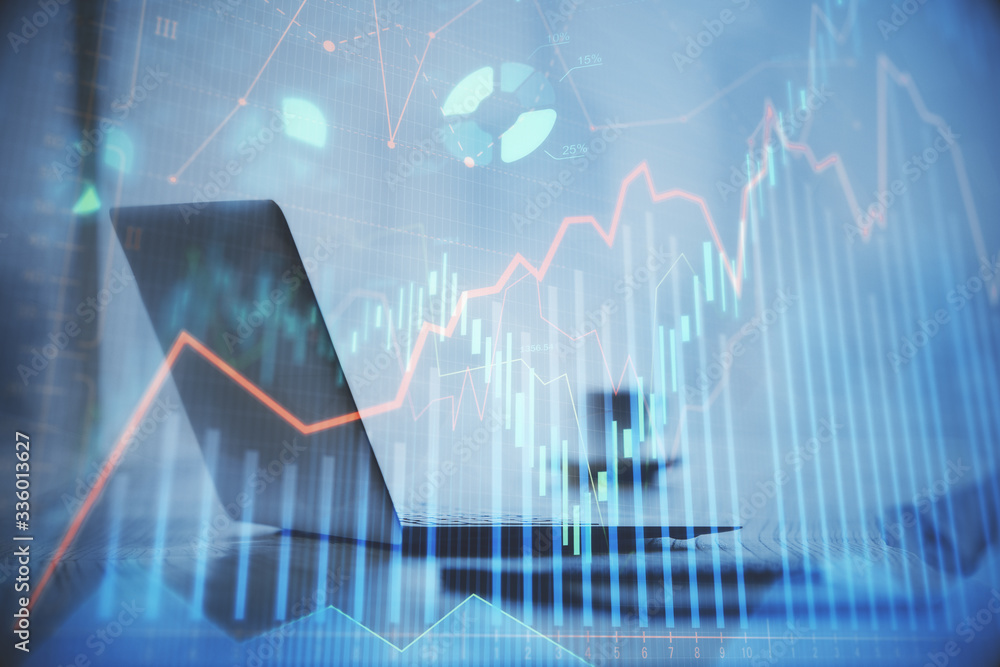 Double exposure of graph and financial info and work space with computer background. Concept of international online trading. Double exposure of graph and financial info and work space with computer background. Concept of international online trading.