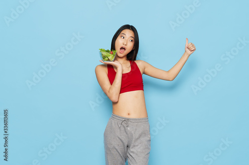 young woman holding a green apple