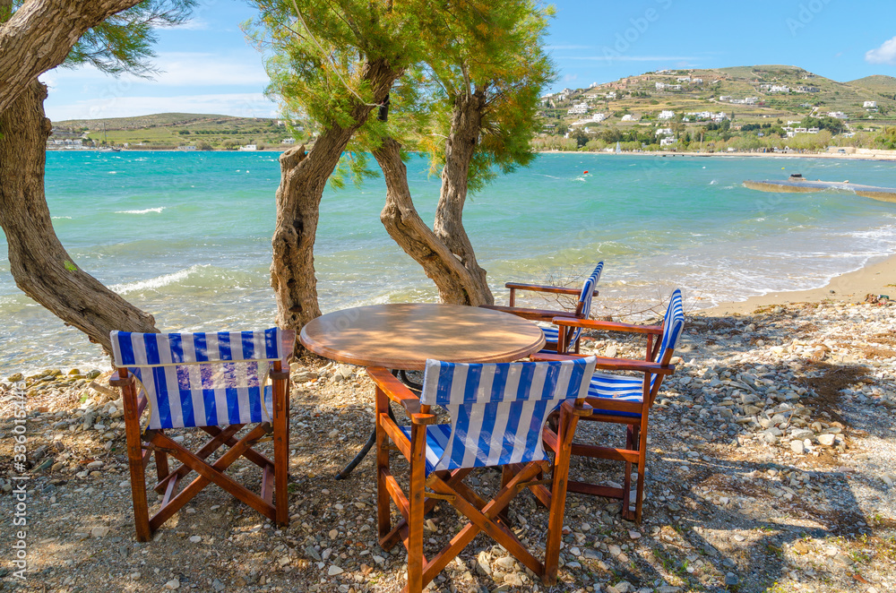 Romantic tavern on the sea coast in Paros island, Cyclades, Greece. Europe.