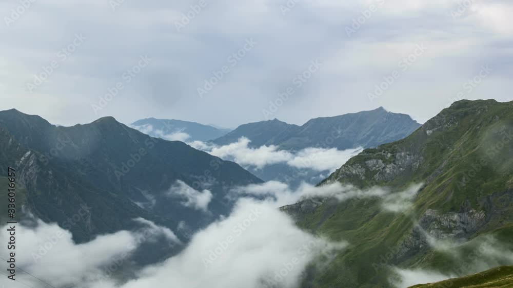 Single clouds are moving through a valley in the Caucasus in Georgia during rainfall