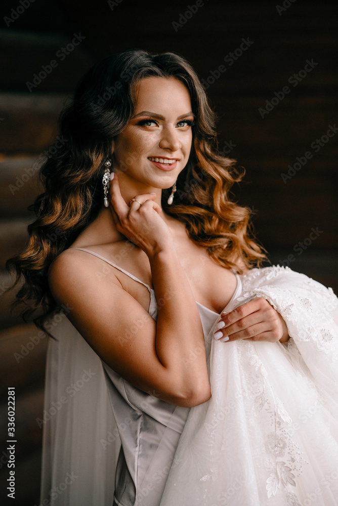 Fototapeta premium morning of the bride. bride on the balcony in the morning