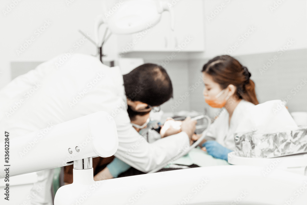 An intern dentist examines a patient under the supervision of a mentor. Professional uniform and equipment of a dentist. Healthcare Equipping a doctor’s workplace. Dentistry. An intern dentist examines a patient under the supervision of a mentor. Professional uniform and equipment of a dentist. Healthcare Equipping a doctor’s workplace. Dentistry.