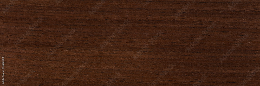 Naklejka premium Excellent dark brown venge veneer background as part of your strict style. Natural wood texture, pattern.