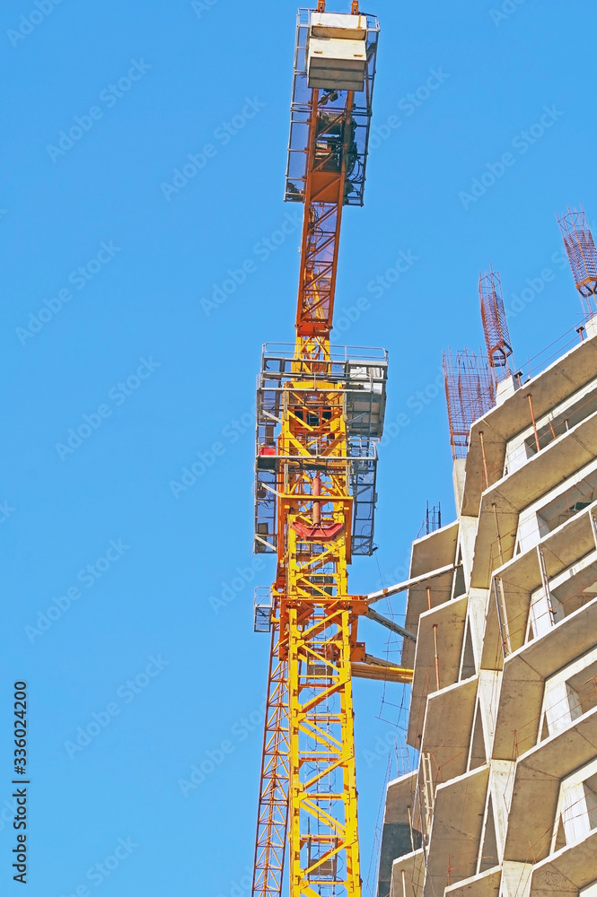 Building crane and building under construction Building crane and building under construction