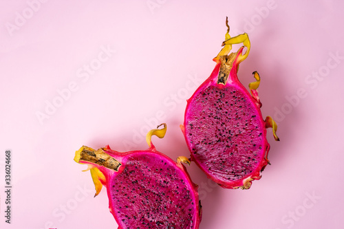 Dragon fruit isolated on violet background photo