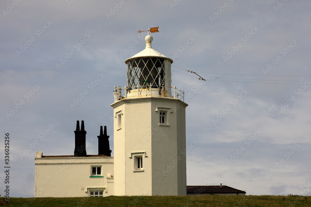 Lizard (England), UK - August 16, 2015: The Lighthouse at the Lizard in Cornwall, Cornwall, England, United Kingdom. Lizard (England), UK - August 16, 2015: The Lighthouse at the Lizard in Cornwall, Cornwall, England, United Kingdom.