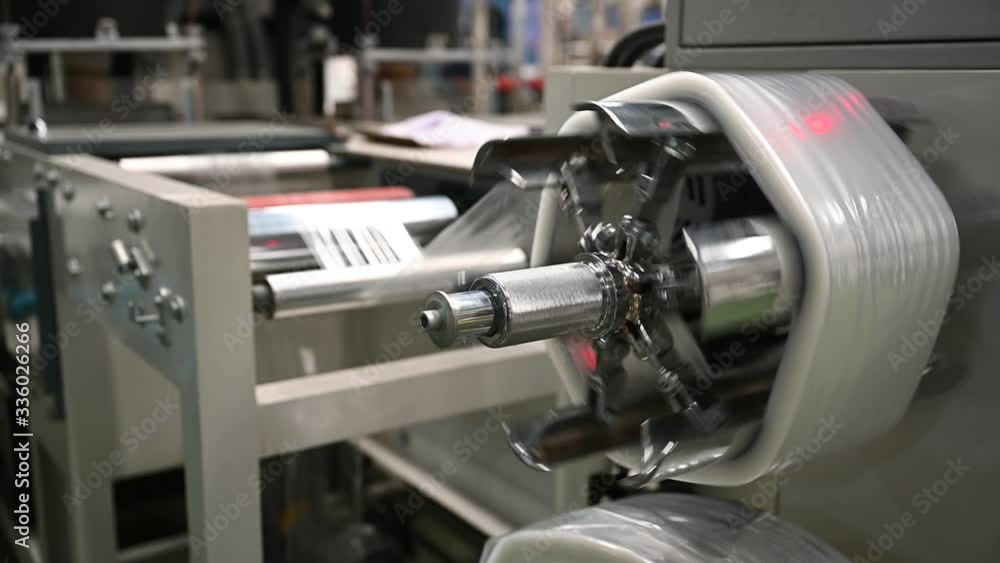 Plastic film making machine Polypropylene To make the bag Close-up storage in a roll In the concept of single use and the environment. Plastic film making machine Polypropylene To make the bag Close-up storage in a roll In the concept of single use and the environment.