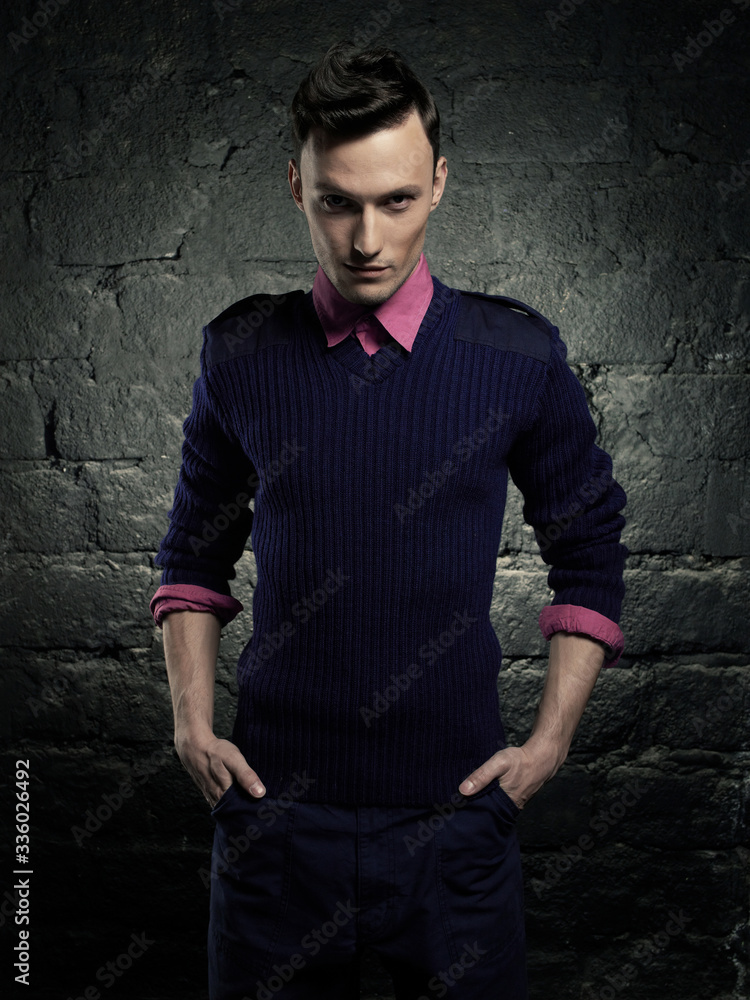 Portrait of a handsome stylish man posing in photostudio Portrait of a handsome stylish man posing in photostudio
