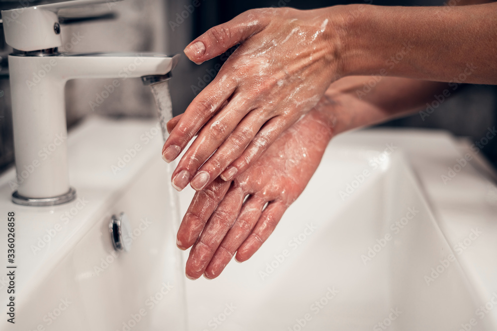 Fototapeta premium Coronavirus. Proper washing and handling of hands. Liquid antibacterial soap. Self-isolation and hygiene.