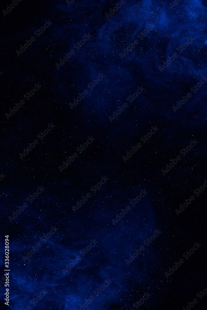 Cosmic galaxy fantasy background with blue clouds and shiny stars