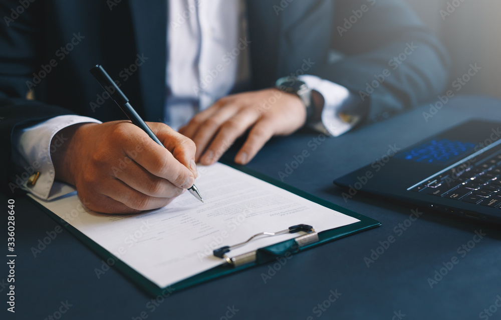 Businessman signing a contract.
Concept of business, loans, pledge and real estate.
Businessman signing a contract.
Concept of business, loans, pledge and real estate.
