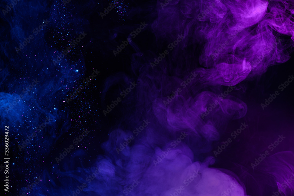 Shiny glitter in clouds of pink and blue fog smoke abstract background Shiny glitter in clouds of pink and blue fog smoke abstract background