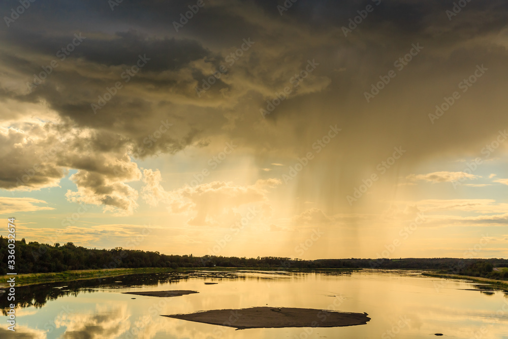 Fototapeta premium Rain Falling at Sunset