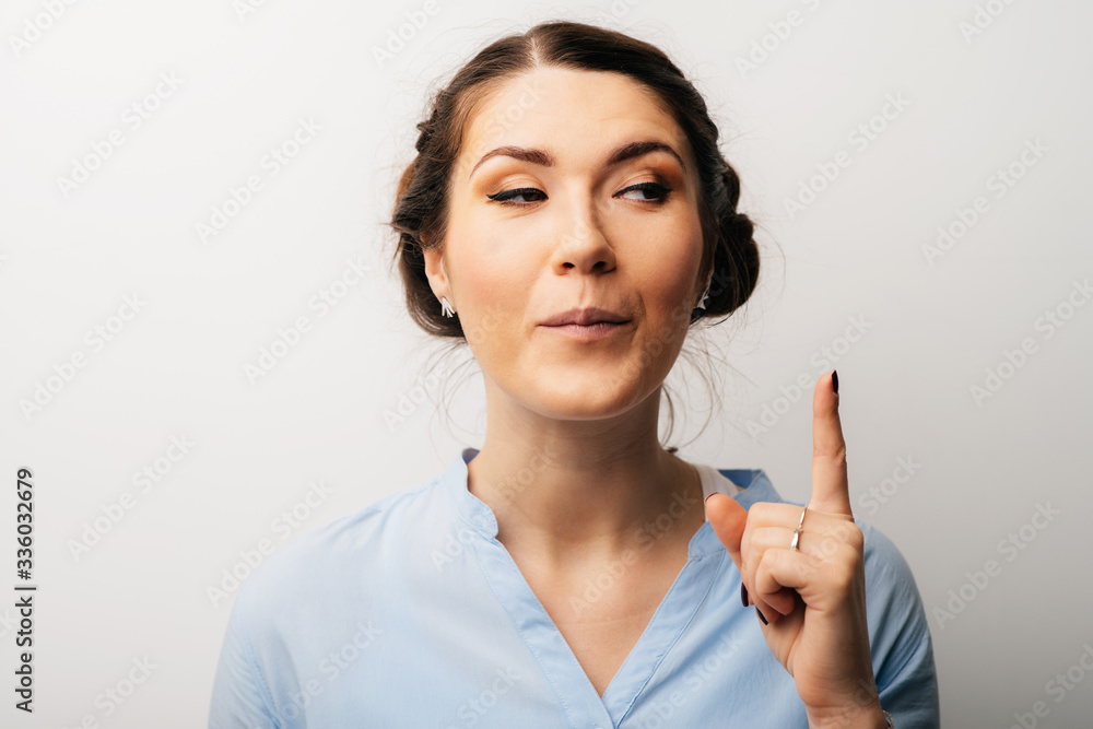 girl shows the index finger up girl shows the index finger up
