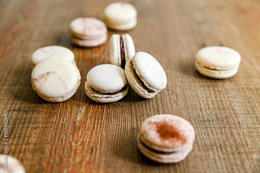 Several pieces of delicious French cookie - macrons. Chocolate flavor.