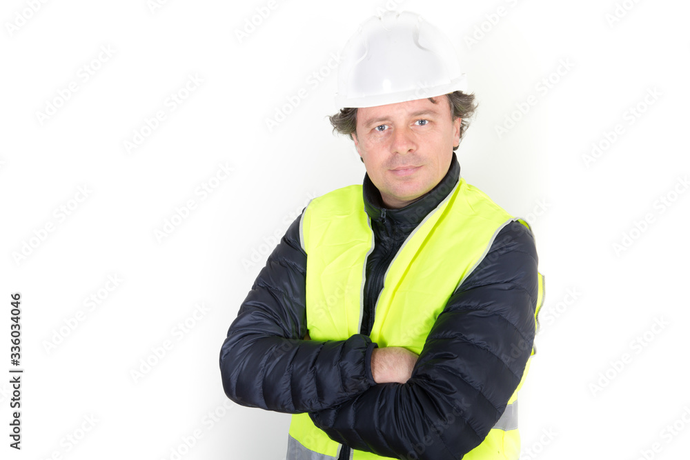 handsome man worker portrait arms crossed folded with hard hat security helmet jacket yellow over white background handsome man worker portrait arms crossed folded with hard hat security helmet jacket yellow over white background