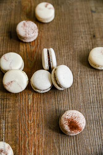 Several pieces of delicious French cookie - macrons. Chocolate flavor.