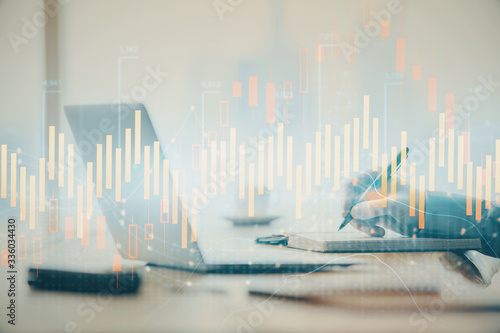 Double exposure of forex chart with man working on computer on background. Concept of market analysis. © peshkova